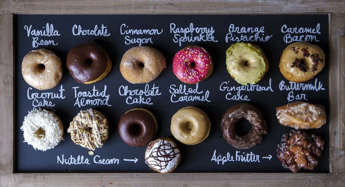 A chalkboard menu of donut flavors